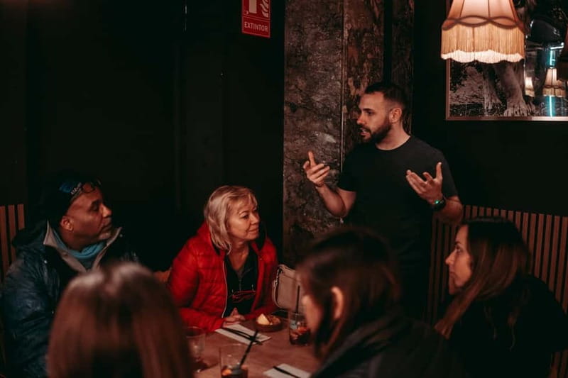 Barcelona: Tipsy Tapas & History Tour in the Gothic Quarter - Third stop: charcuterie, cheese, and live music