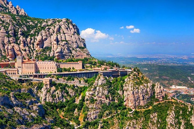 Sagrada Familia & Montserrat Private Tour with Hotel pick-up - Port Vell, Columbus Monument, and the coast
