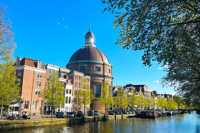 Walking Tour about Golden Age Architecture, private local guide - Dam Square and the Royal Palace